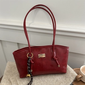 Vintage burgundy faux leather tote bag with large capacity and gold bell charm detail