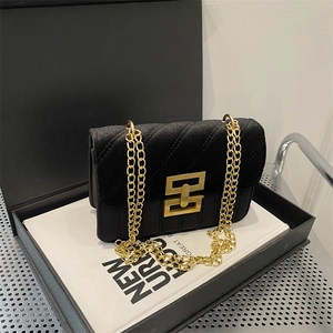 Elegant black velvet crossbody bag with chevron quilting and golden chain strap