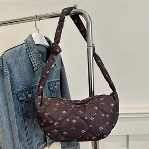 Brown floral quilted nylon dumpling bag with wide shoulder strap and zip closure