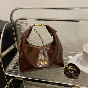 Vintage dark brown oil leather hobo dumpling bag with gold metal hardware and strap