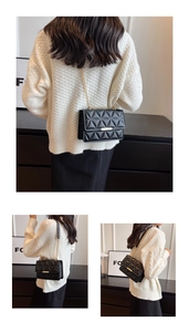 Detailed back and side view of black quilted crossbody bag with gold chain strap
