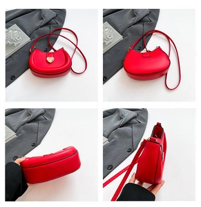 Detail shots of a red heart-shaped buckle saddle bag from multiple angles and perspectives