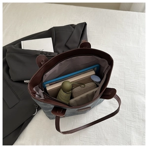 Spacious dark grey canvas tote bag interior showing laptop and daily essentials storage