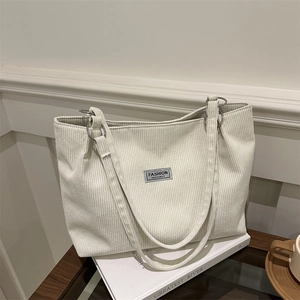 Minimalist beige corduroy tote bag for women with spacious design and fashion label