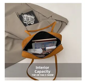 Detail view showing the large internal capacity of the mustard yellow square tote bag