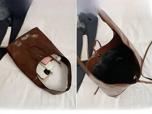 Macro view of brown leather tote bag interior with magnetic clasp and spacious storage