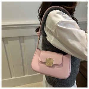 Side view of a light pink minimalist underarm bag featuring a metallic square buckle