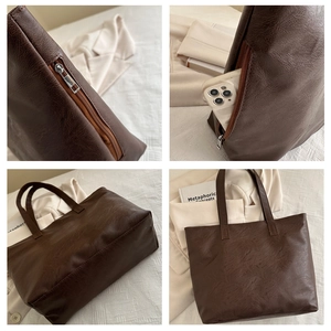 Detailed view of the dark brown tote bag with pebble texture and functional side pocket