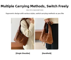 Brown leather tote bag detail showing dual usage as shoulder and handbag styles