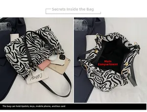 Detail view of large zebra print tote bag interior and capacity with gold hardware rings