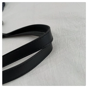 Detail of black faux leather strap with lychee texture and durable double stitching