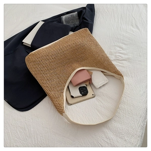 Top view of woven tote bag interior showing capacity for wallet and smartphone