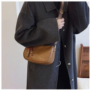 Brown vintage Boston bag with studded leather straps and ethnic style wide shoulder strap
