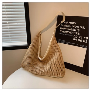 Detail of hand-woven straw tote bag with premium white leather shoulder strap and texture