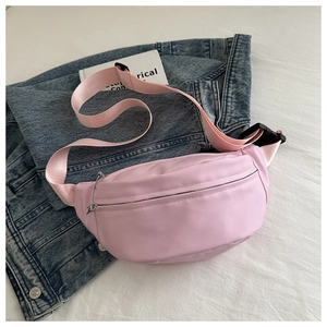 Detailed view of pink casual fanny pack with adjustable strap and metal zipper