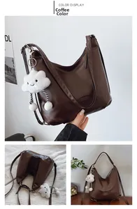 Detailed coffee brown faux leather hobo tote bag featuring a plush cloud charm accessory