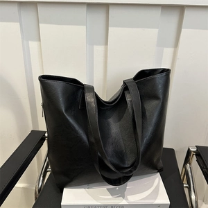 Minimalist black faux leather tote bag with large capacity for office and daily commuting