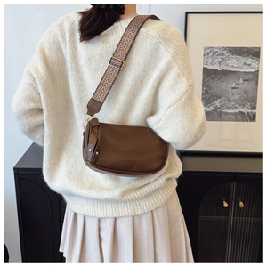 Brown retro crossbody pillow bag featuring a stylish zigzag patterned wide strap