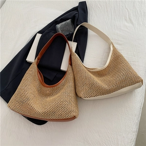 Retro woven straw tote bag with leather trim and wide shoulder strap for beach vacation