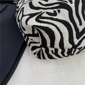 Large capacity zebra print tote bag with woven texture and reinforced bottom corners