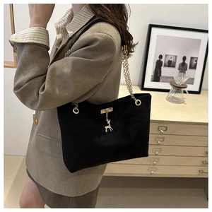 Elegant black frosted shoulder tote bag with golden deer pendant and chain strap