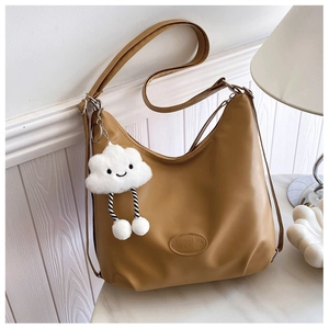 Detail of khaki crescent shoulder bag with smooth PU leather and cute cloud charm