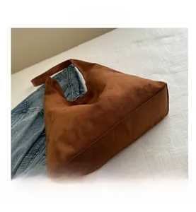 Close-up of deep brown matte suede texture and durable stitching on large tote bag