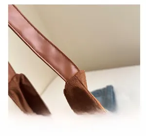 Detail shot of brown frosted tote showing precision stitching and premium leather texture