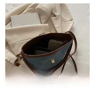 Internal view of the retro crossbody bucket bag with interior pocket and spacious capacity