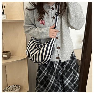 Blue and white striped canvas crossbody hobo bag with adjustable strap for daily use