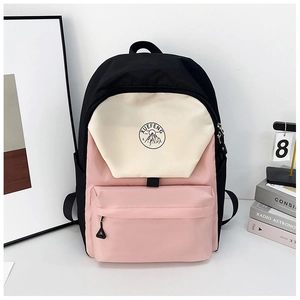 Detail of color-block backpack with XUEFENG logo and waterproof nylon texture