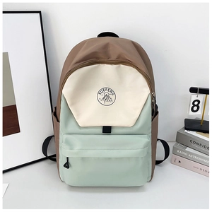 Detail of multi-color laptop backpack with XUEFENG logo and waterproof nylon texture