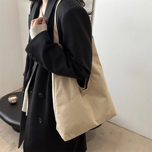 Minimalist beige matte tote bag for women with wide strap in a spacious shoulder design