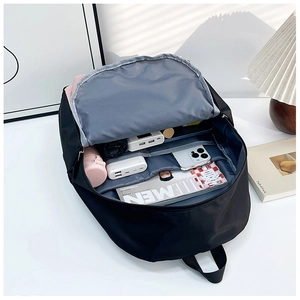 Detailed view of the waterproof nylon backpack interior with multi-functional compartments