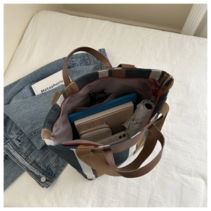 Top view of striped tote bag interior showing large capacity for tablet and daily items
