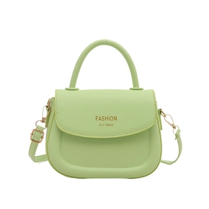 Fashionable lime green PU leather saddle handbag with top handle and crossbody strap