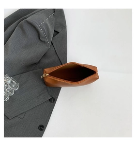 Top view of spacious interior with zipper detail of this dark brown leather tote bag