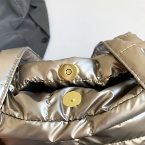 Champagne gold quilted tote bag with metallic finish and round magnetic snap closure