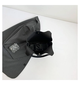 Top view of black leather tote bag showing large capacity and magnetic buckle closure