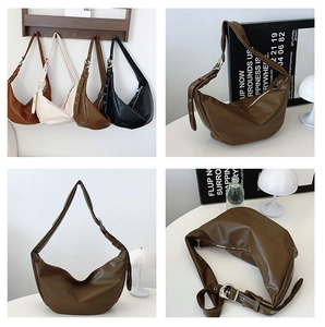 Detail of crescent shoulder bag with adjustable wide strap and silver buckle in four colors