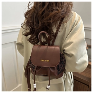 Detailed back view of vintage mini brown backpack with leopard print and fashion text