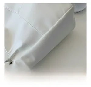Detailed close-up of premium white tote bag showing high-quality fabric and silver chain