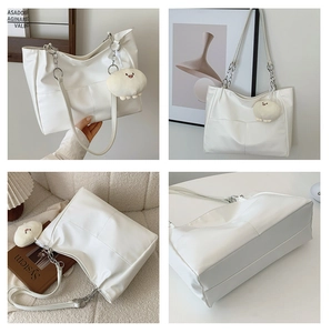 Detail shots of off-white leather tote bag with silver chain and plush smiley pendant