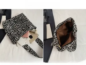 Detailed view of spacious leopard print tote interior holding a tablet and daily essentials