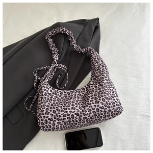 Detail of leopard print hobo bag with unique ruched scrunchie shoulder strap design