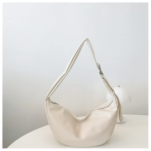 Detail of off-white hobo bag showing zipper closure and silver metal ring buckle