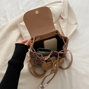 Leopard print leopard bucket backpack with drawstring closure and golden magnetic clasp