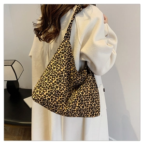 Detail of leopard print hobo bag showing large capacity canvas and soft fabric texture