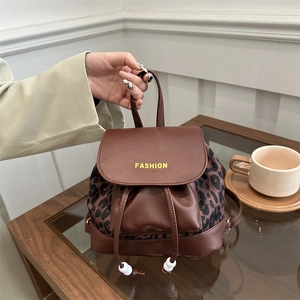 Brown leather women's mini backpack with leopard print accents and fashion print
