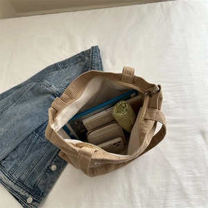 Khaki corduroy tote bag showing large capacity for tablet, umbrella, and essentials